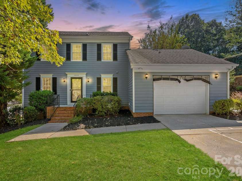 12424 Cool Mist Lane, Huntersville, NC 28078.  MLS# CAR4433827, YatesRealty ID 56960. Front exterior at dusk. *Photo has been virtually enhanced.*