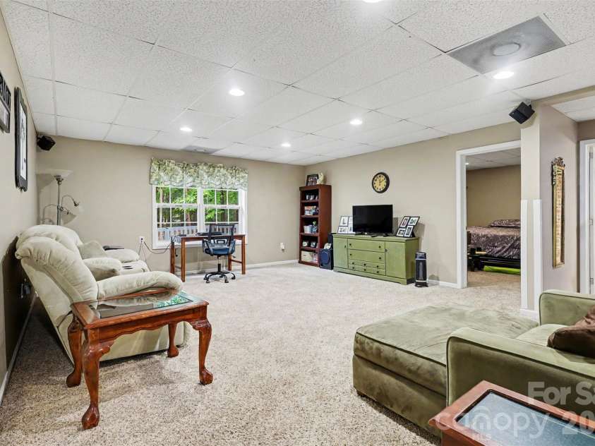 5221 Turkey Oak Drive, Mint Hill, NC 28227.  MLS# CAR4433763, YatesRealty ID 56962. Basement Great Room