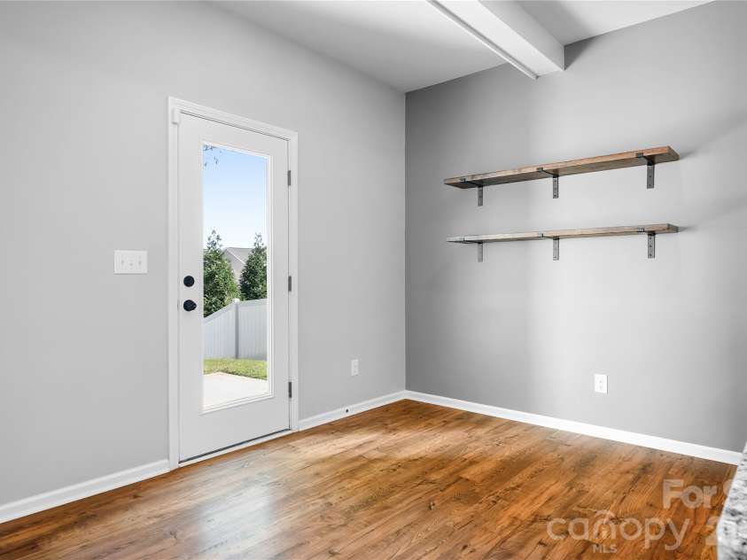 117 Abel Peterson Drive, Mount Holly, NC 28120.  MLS# CAR4433396, YatesRealty ID 56976. Breakfast nook custom shelving