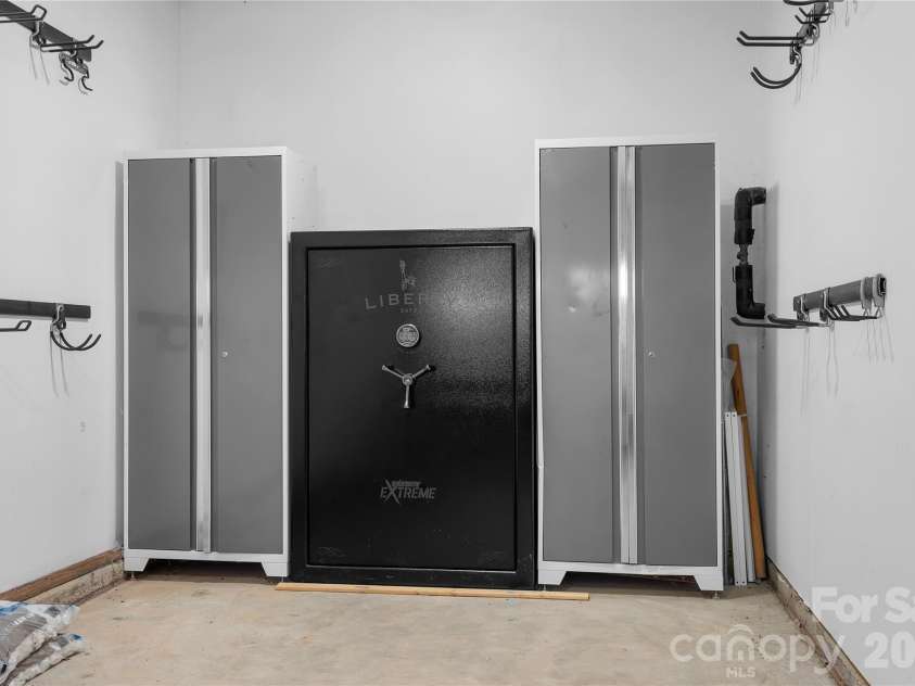 117 Abel Peterson Drive, Mount Holly, NC 28120.  MLS# CAR4433396, YatesRealty ID 56976. Built-in storage lockers & safe in garage