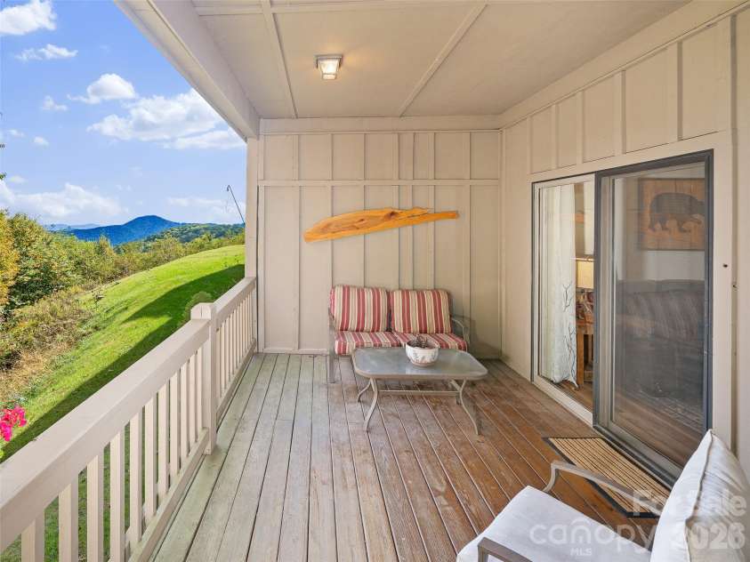 2521 Wolf Laurel Road, Mars Hill, NC 28754.  MLS# CAR4432909, YatesRealty ID 56984. Large private covered porch