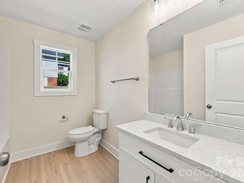 808 4th Street, Albemarle, NC 28001.  MLS# CAR4432385, YatesRealty ID 56988. En Suite Bathroom in Primary