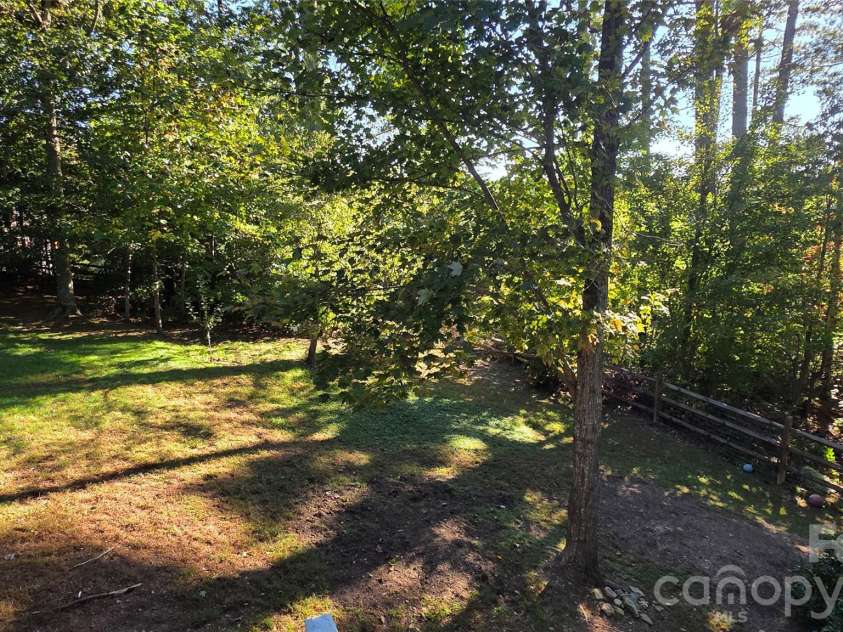 52 Enochs Way Way, Fletcher, NC 28732.  MLS# CAR4432358, YatesRealty ID 56989. So much yard for playtime.