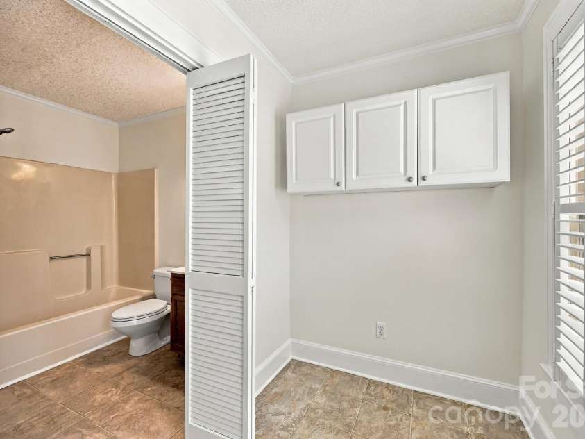 2205 Pennsylvania Avenue, Kannapolis, NC 28083.  MLS# CAR4431254, YatesRealty ID 57002. Laundry room off full bath.
