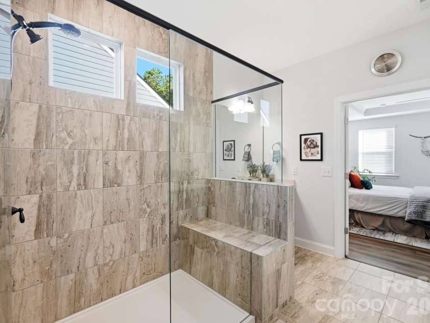 2014 Old Evergreen Parkway, Indian Trail, NC 28079.  MLS# CAR4433757, YatesRealty ID 57036. Large shower with subway tile, built-in bench and additional transom window for natural light