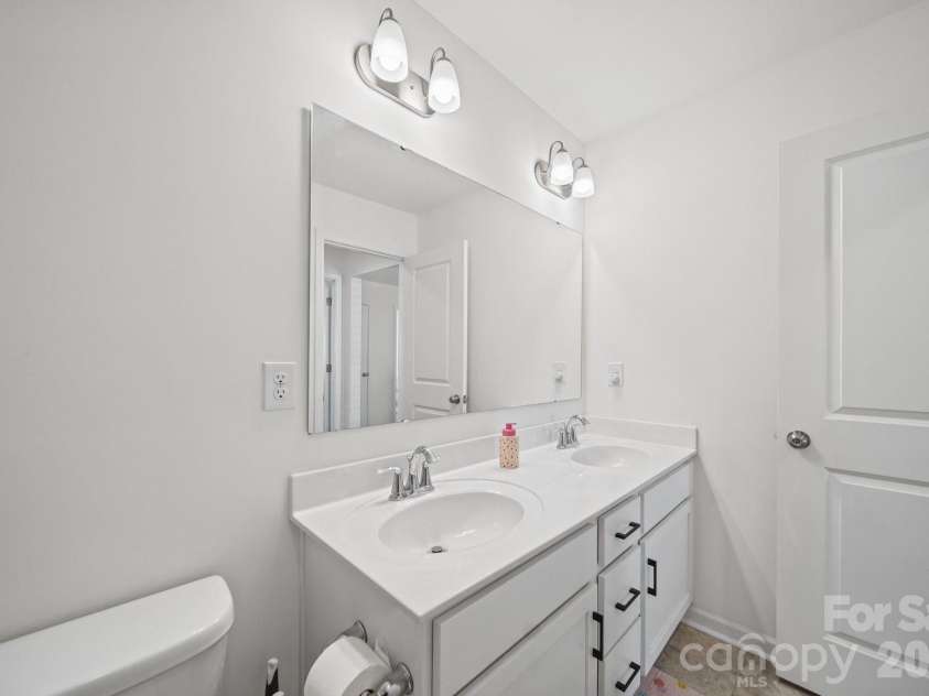 6332 Rocky Wagon Lane, Concord, NC 28025.  MLS# CAR4426776, YatesRealty ID 57039. Hallway Bathroom
