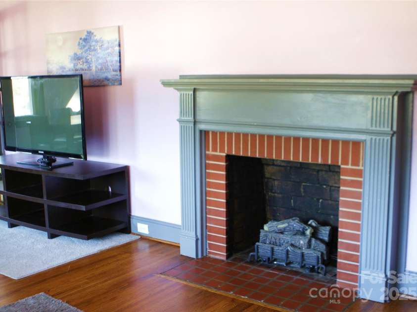 308 Hawthorne Street, Mount Holly, NC 28120.  MLS# CAR4216489, YatesRealty ID 5712. Front room fireplace