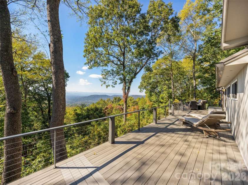 21 Peach Knob Drive, Asheville, NC 28804.  MLS# CAR4435411, YatesRealty ID 57132. Long range views from this expansive deck