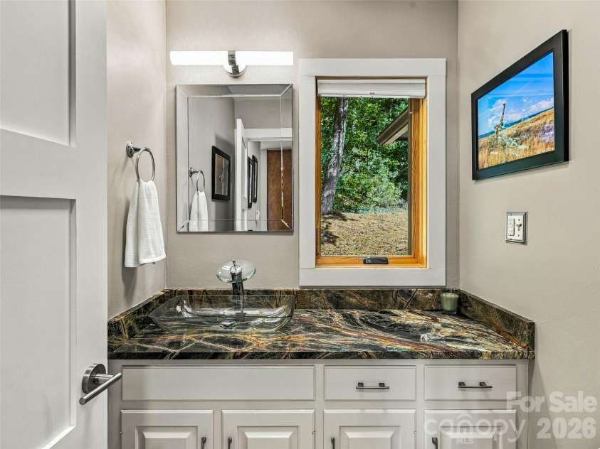 21 Peach Knob Drive, Asheville, NC 28804.  MLS# CAR4435411, YatesRealty ID 57132. Main floor half bath