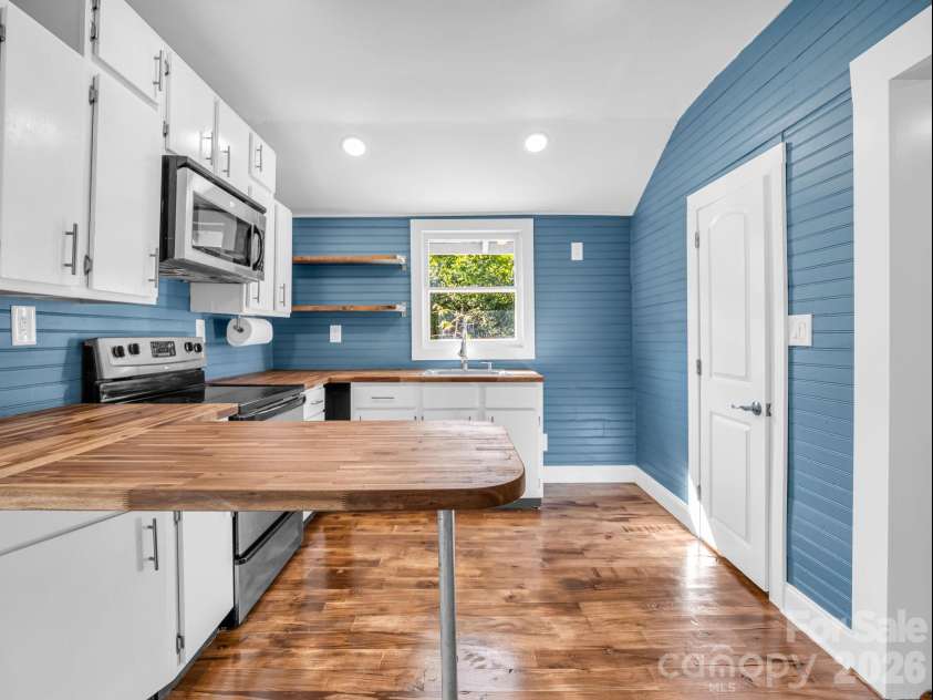 51 Shepherd Street, Tryon, NC 28782.  MLS# CAR4434123, YatesRealty ID 57136. Beadboard walls