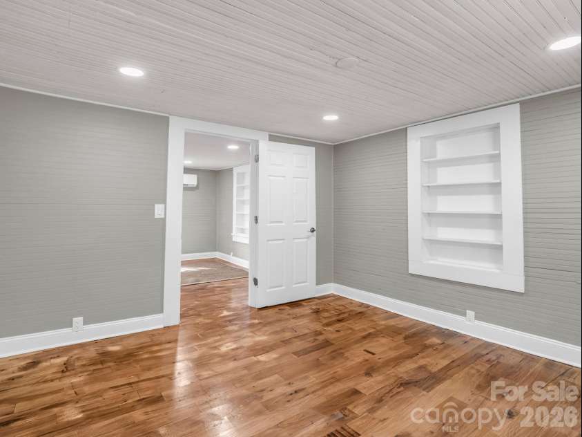 51 Shepherd Street, Tryon, NC 28782.  MLS# CAR4434123, YatesRealty ID 57136. Bedroom #2 with built-in