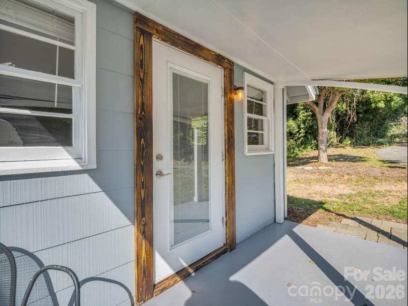 51 Shepherd Street, Tryon, NC 28782.  MLS# CAR4434123, YatesRealty ID 57136. Covered front porch