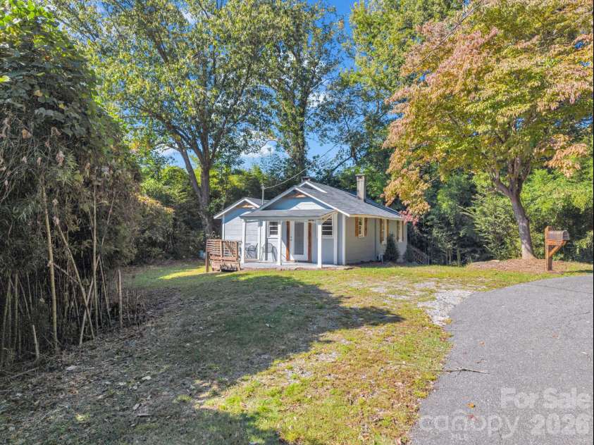 51 Shepherd Street, Tryon, NC 28782.  MLS# CAR4434123, YatesRealty ID 57136. Covered front porch and deck