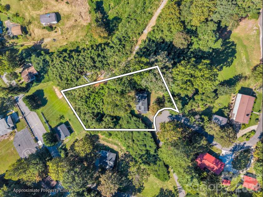 51 Shepherd Street, Tryon, NC 28782.  MLS# CAR4434123, YatesRealty ID 57136. Double lot