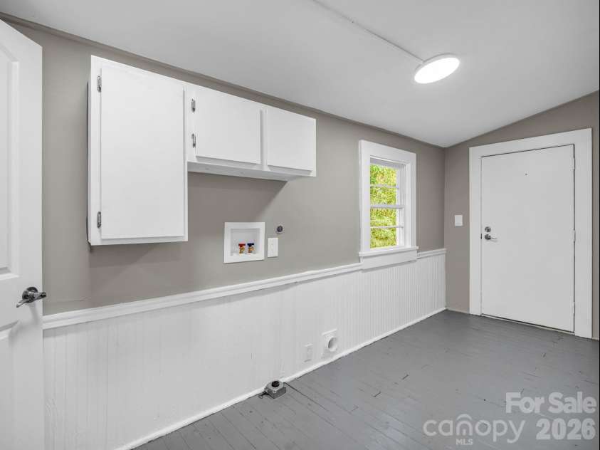 51 Shepherd Street, Tryon, NC 28782.  MLS# CAR4434123, YatesRealty ID 57136. Laundry room