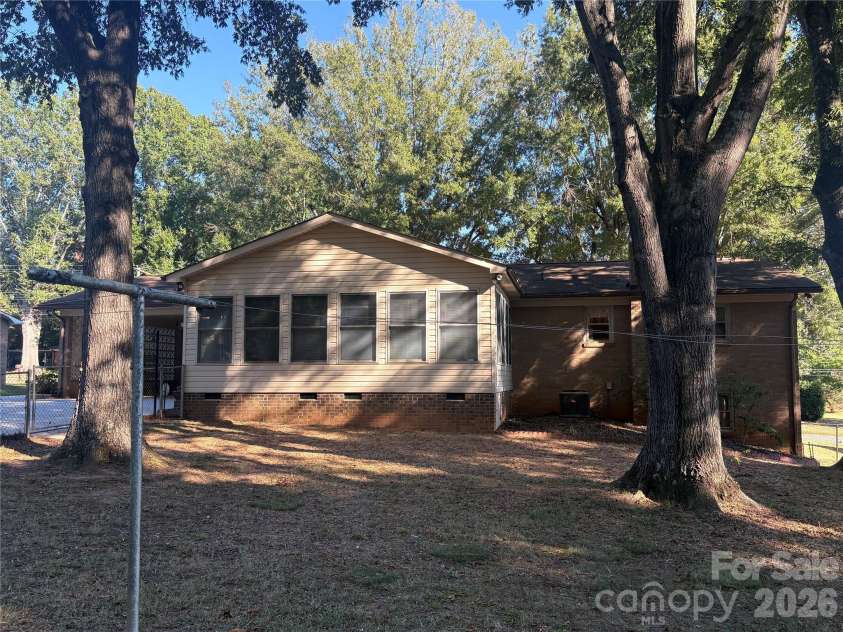 94 Tulip Avenue, Concord, NC 28025.  MLS# CAR4435284, YatesRealty ID 57141. Back yard view and sunroom