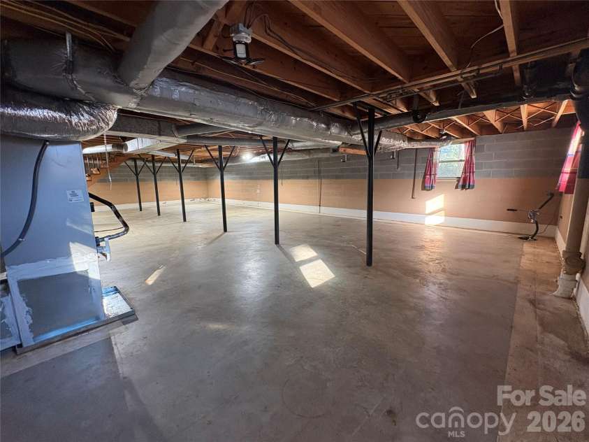 94 Tulip Avenue, Concord, NC 28025.  MLS# CAR4435284, YatesRealty ID 57141. Basement view from exterior access