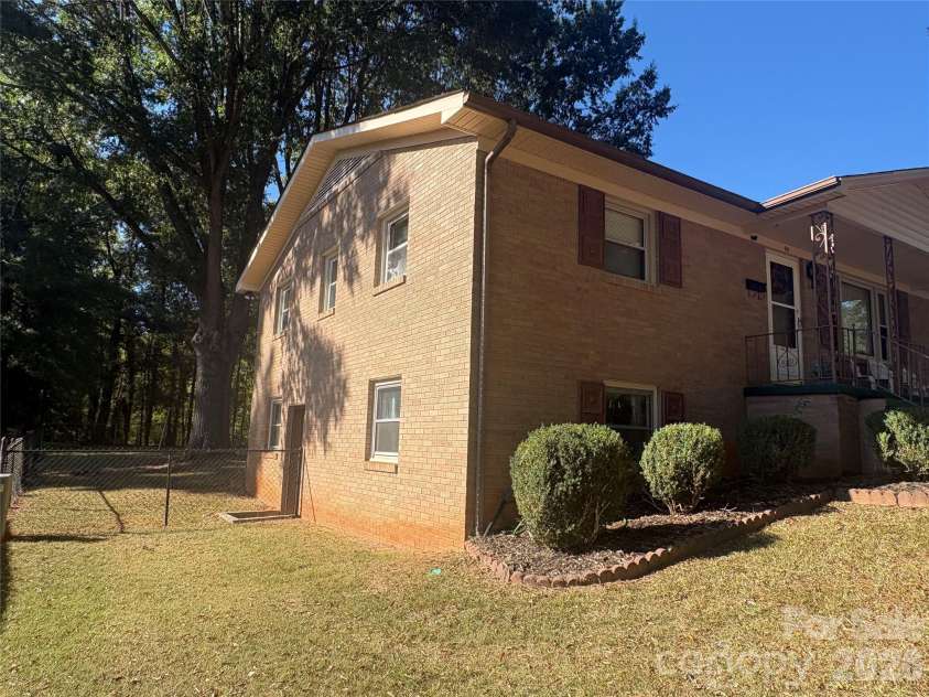 94 Tulip Avenue, Concord, NC 28025.  MLS# CAR4435284, YatesRealty ID 57141. Side view and exterior basement accesss