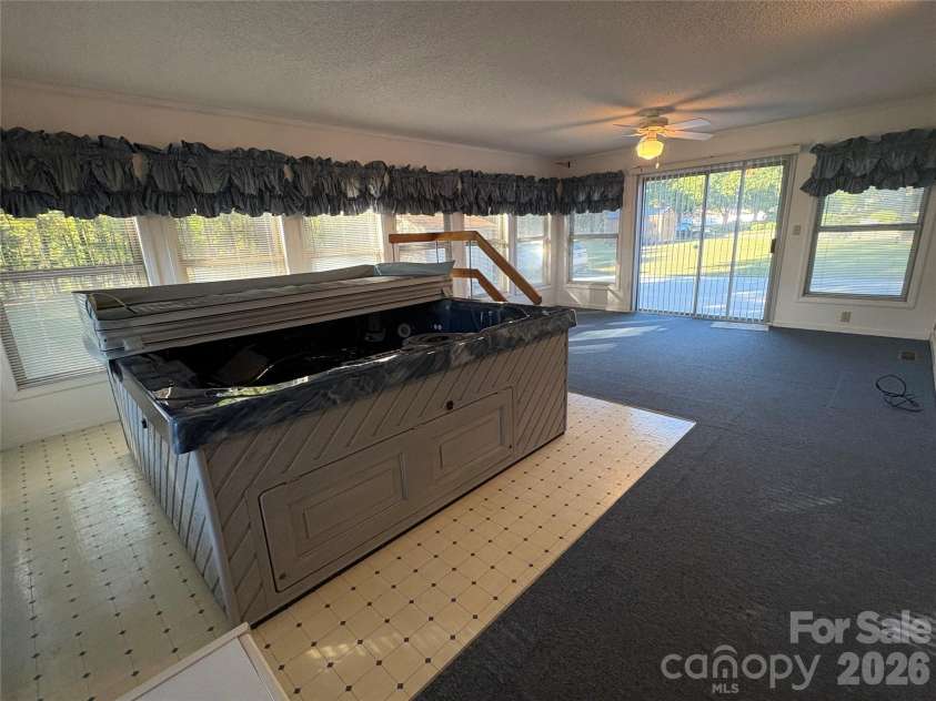 94 Tulip Avenue, Concord, NC 28025.  MLS# CAR4435284, YatesRealty ID 57141. Sun Room 1