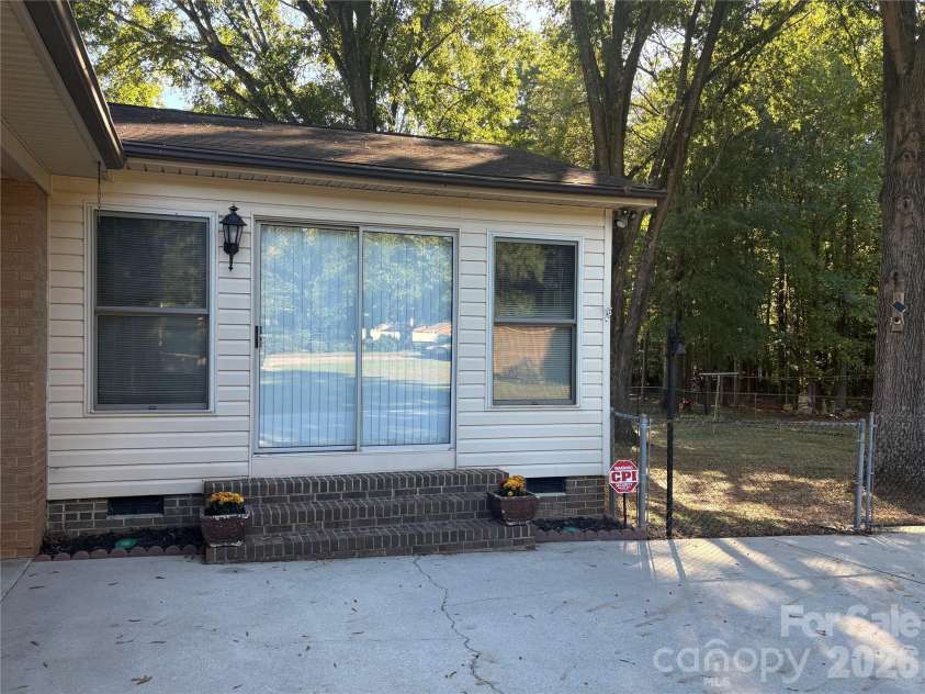 94 Tulip Avenue, Concord, NC 28025.  MLS# CAR4435284, YatesRealty ID 57141. Sun room addition