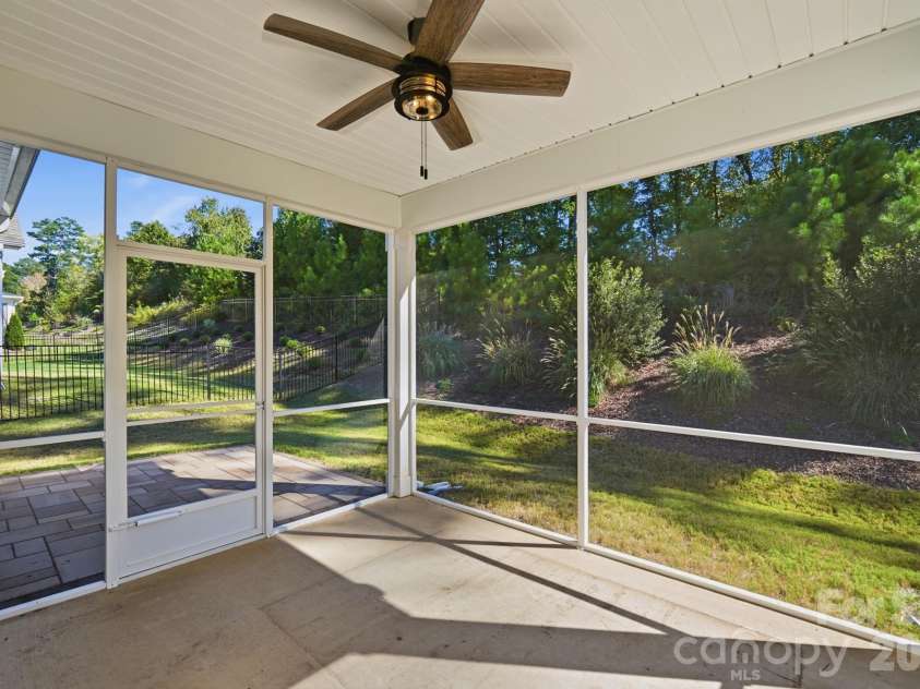 7656 Tanglewood Way, Denver, NC 28037.  MLS# CAR4434758, YatesRealty ID 57146. Large covered and screened in back porch facing your tree lined back yard