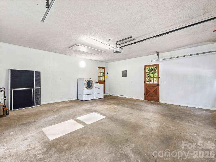 133 Kent Lane, Hendersonville, NC 28739.  MLS# CAR4433472, YatesRealty ID 57156. Oversized 2-car Garage has Designated Laundry Area