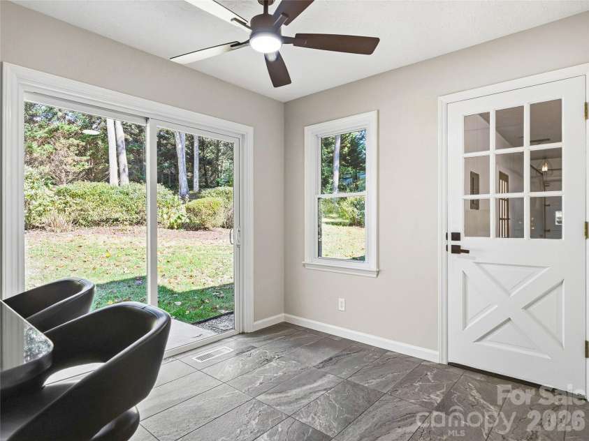 133 Kent Lane, Hendersonville, NC 28739.  MLS# CAR4433472, YatesRealty ID 57156. Sliding Doors in Kitchen Opens to Patio