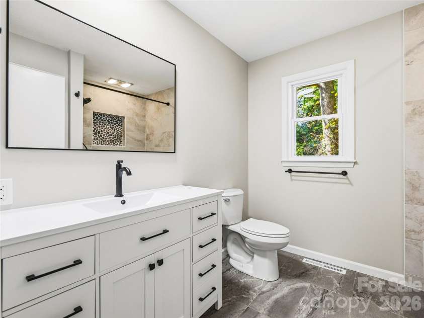 133 Kent Lane, Hendersonville, NC 28739.  MLS# CAR4433472, YatesRealty ID 57156. Updated Second Bathroom