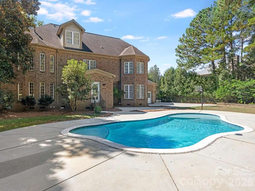 9200 Skipaway Drive, Waxhaw, NC 28173.  MLS# CAR4398254, YatesRealty ID 57165. Pool & Rear Elevation