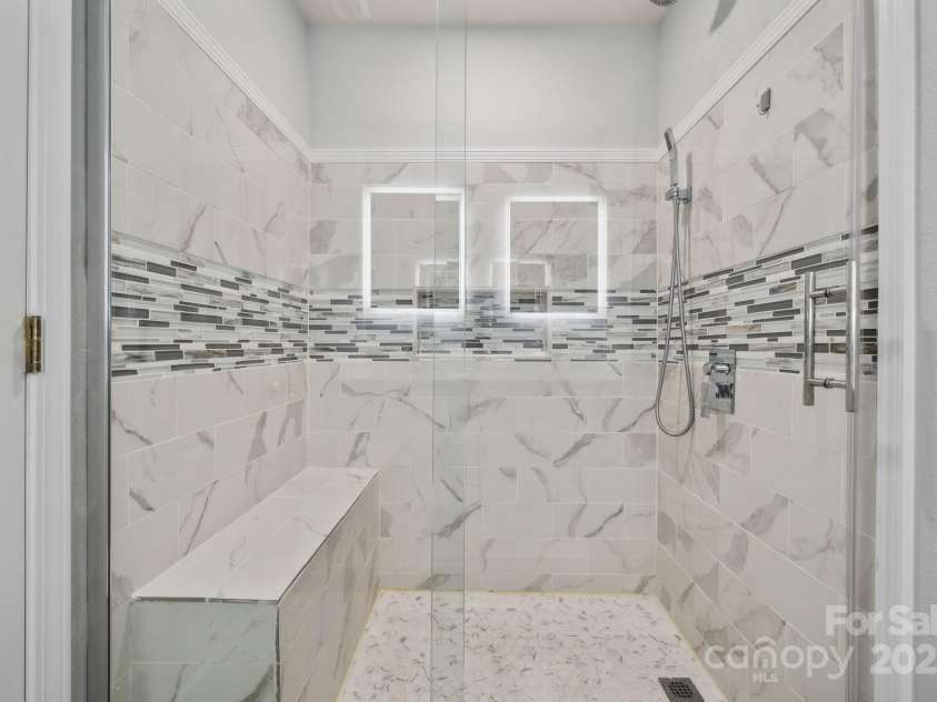 4211 Center Place Drive, Harrisburg, NC 28075.  MLS# CAR4277527, YatesRealty ID 5717. Walk-in tile shower in primary bath