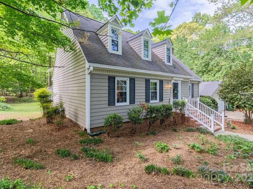7514 Pewter Lane, Charlotte, NC 28270.  MLS# CAR4244658, YatesRealty ID 5718. Beautifully landscaped and wooded yard.