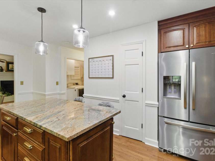 7514 Pewter Lane, Charlotte, NC 28270.  MLS# CAR4244658, YatesRealty ID 5718. Fresh paint and updated light fixtures over the large island.