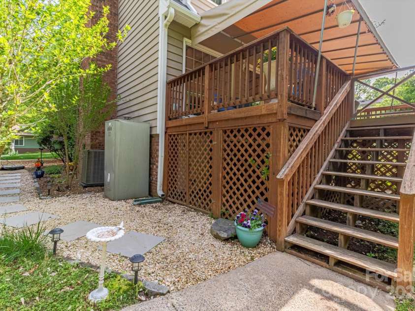 7514 Pewter Lane, Charlotte, NC 28270.  MLS# CAR4244658, YatesRealty ID 5718. Stairs leading to the large backyard and garage.