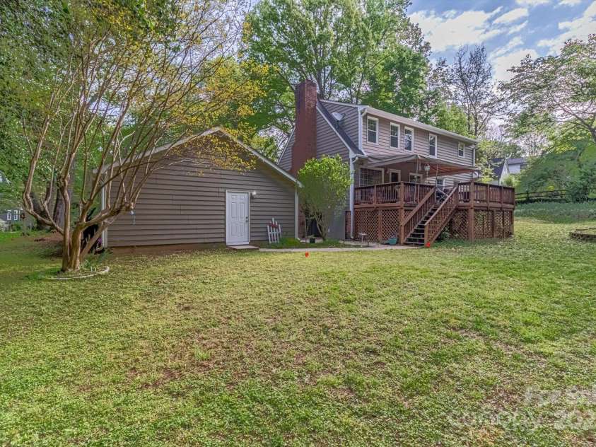 7514 Pewter Lane, Charlotte, NC 28270.  MLS# CAR4244658, YatesRealty ID 5718. The .63 acre lot is vast and partially wooded.