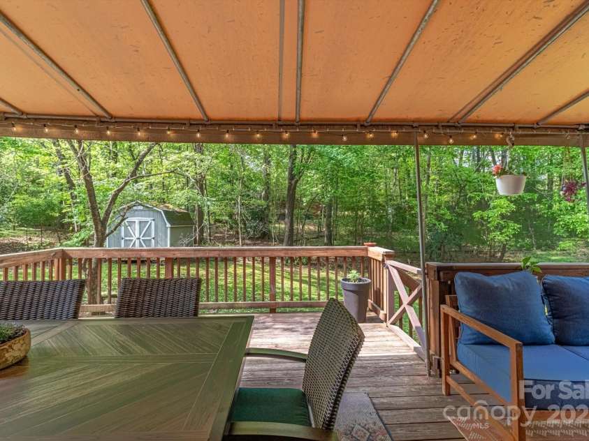 7514 Pewter Lane, Charlotte, NC 28270.  MLS# CAR4244658, YatesRealty ID 5718. The covered deck is large with multiple seating areas.