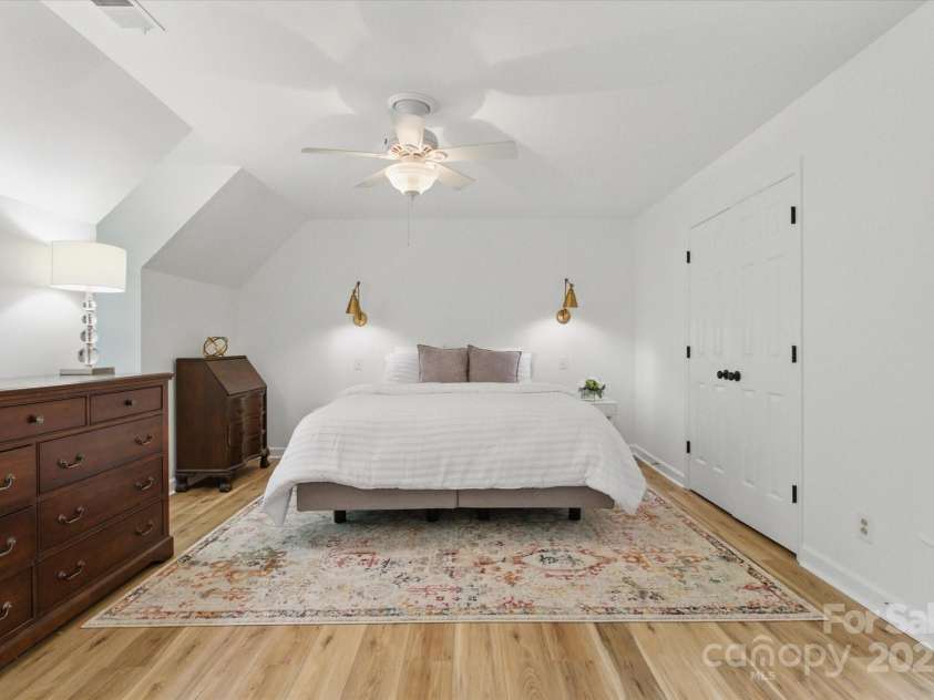 7514 Pewter Lane, Charlotte, NC 28270.  MLS# CAR4244658, YatesRealty ID 5718. The large primary bedroom suite with new flooring and fresh paint.