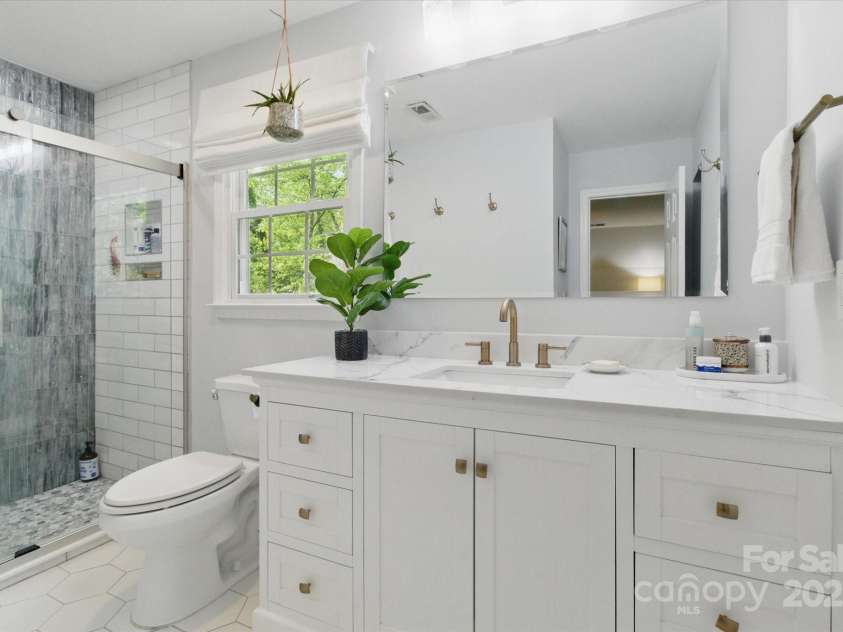 7514 Pewter Lane, Charlotte, NC 28270.  MLS# CAR4244658, YatesRealty ID 5718. The newly updated primary bathroom has lots of storage and lcounter space.