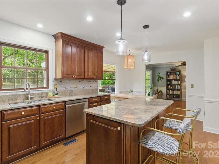 7514 Pewter Lane, Charlotte, NC 28270.  MLS# CAR4244658, YatesRealty ID 5718. The open kitchen with large island and ample storage.