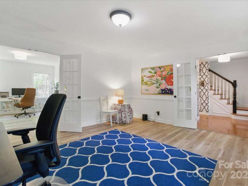 7514 Pewter Lane, Charlotte, NC 28270.  MLS# CAR4244658, YatesRealty ID 5718. Two sets of french doors allow added privacy in this space. New flooring is throughout most the downstairs area.