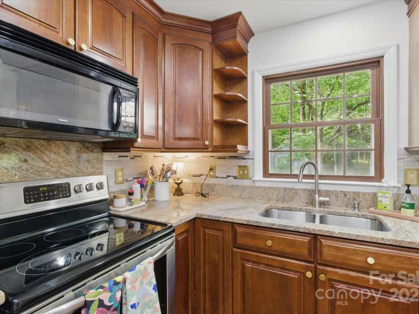 7514 Pewter Lane, Charlotte, NC 28270.  MLS# CAR4244658, YatesRealty ID 5718. View of the backyard from the kitchen window.