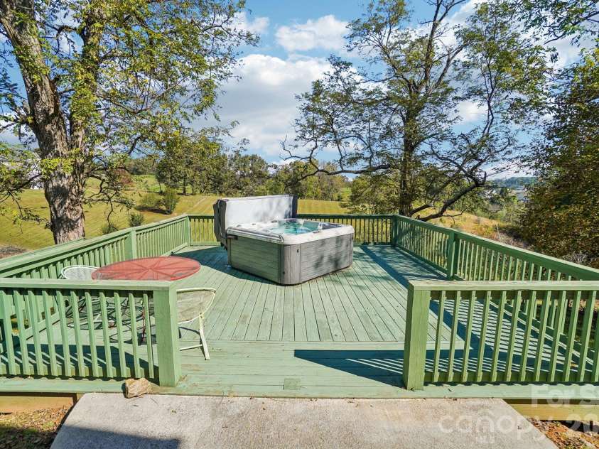 499 Flint Hill Road, Alexander, NC 28701.  MLS# CAR4409425, YatesRealty ID 57181. Hot Tub on lower back deck