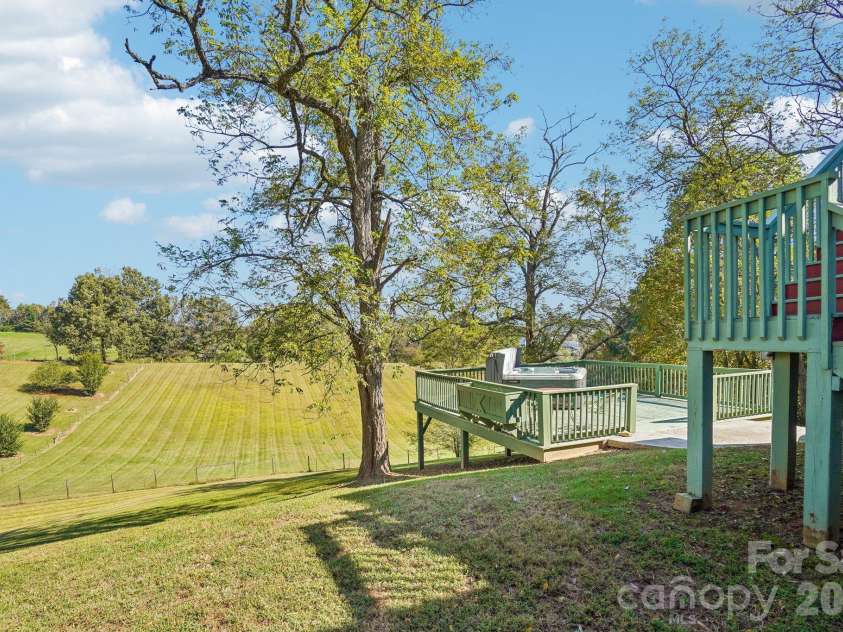 499 Flint Hill Road, Alexander, NC 28701.  MLS# CAR4409425, YatesRealty ID 57181. Hot Tub on lower back deck