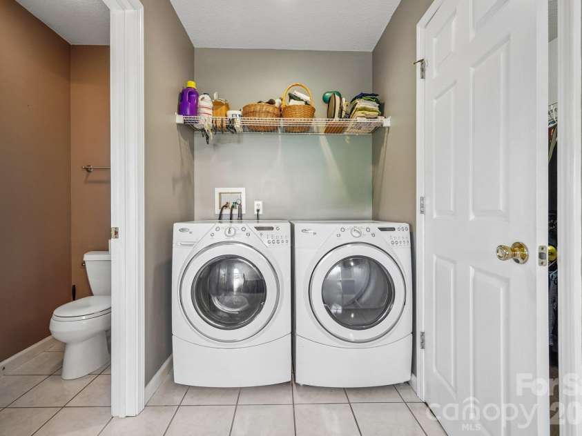 499 Flint Hill Road, Alexander, NC 28701.  MLS# CAR4409425, YatesRealty ID 57181. Washer/Dryer in Main Bath