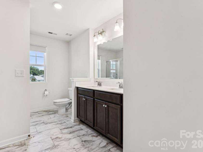 2625 Trinity Street, Monroe, NC 28110.  MLS# CAR4435545, YatesRealty ID 57186. Primary bath