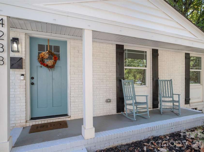 4238 Dowling Drive, Charlotte, NC 28205.  MLS# CAR4434485, YatesRealty ID 57237. Rocking Chair front porch