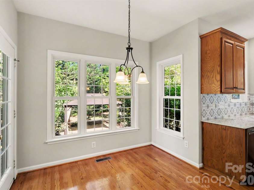 17028 Hampton Trace Road, Huntersville, NC 28078.  MLS# CAR4435476, YatesRealty ID 57242. Breakfast area overlooking backyard