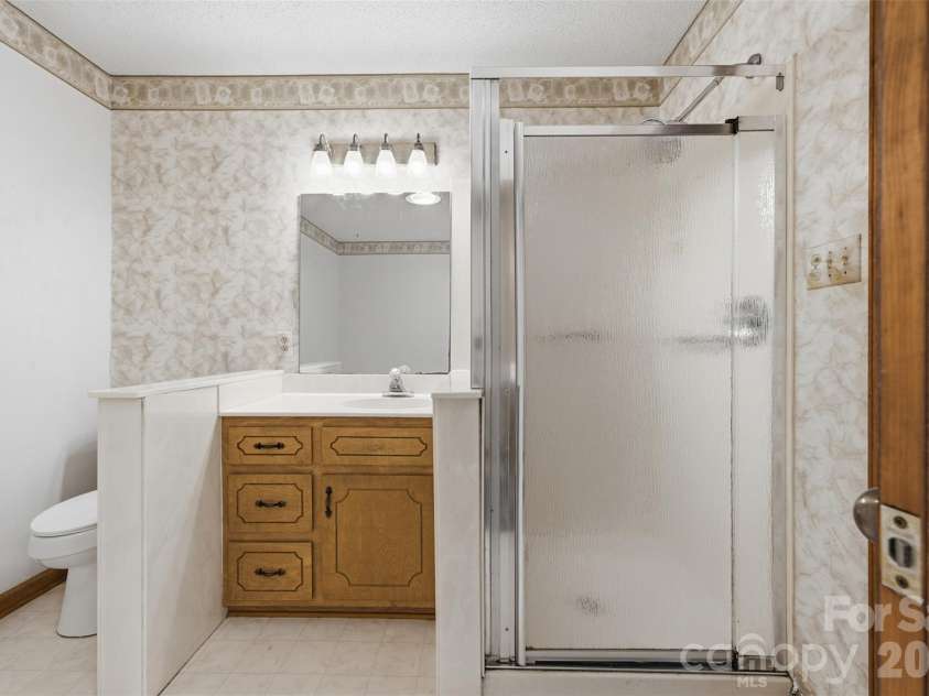 8607 Wellington Lane, Harrisburg, NC 28075.  MLS# CAR4435487, YatesRealty ID 57245. Primary Bathroom
