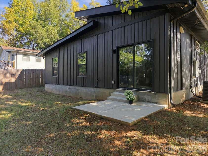 571 Buford Drive, Concord, NC 28025.  MLS# CAR4434170, YatesRealty ID 57269. BBQ patio right off kitchen