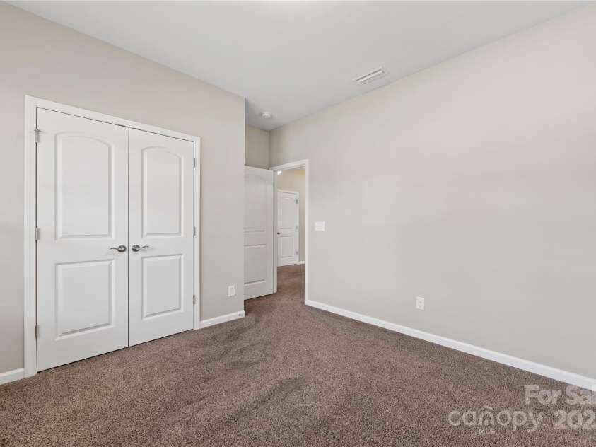 6615 Buck Horn Place, Waxhaw, NC 28173.  MLS# CAR4234328, YatesRealty ID 5728. Front Bedroom