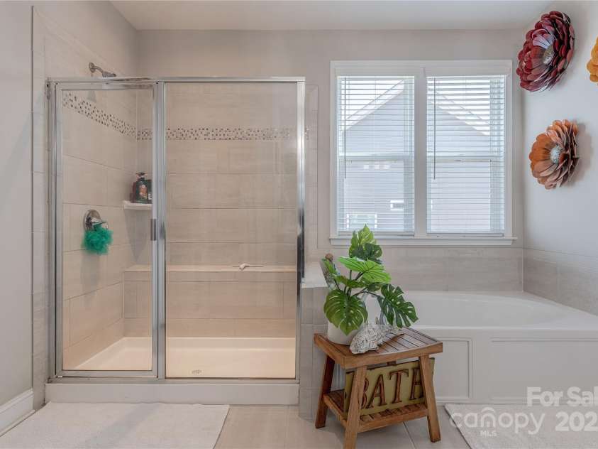 1048 Harbor Bay Drive, Indian Land, SC 29707.  MLS# CAR4231848, YatesRealty ID 5733. Glass Enclosed Shower & Garden Tub